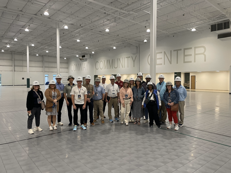 Group photo of the 2025 GFW Inc. Inter-City Visit Attendees at the Conway Community Center