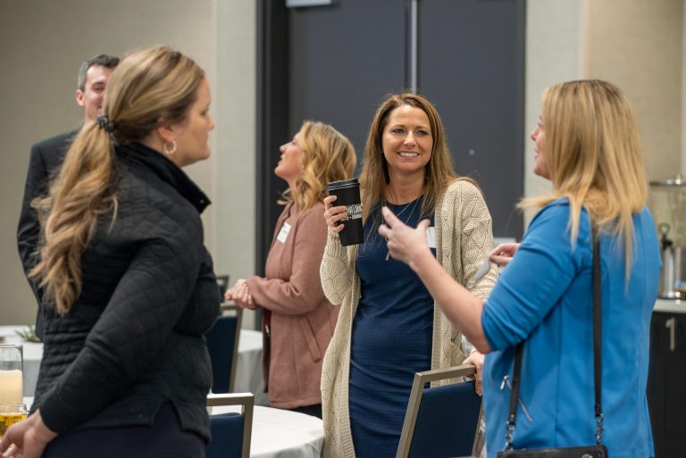 Attendees networking at GFW Inc. Workforce & Waffles Seminar